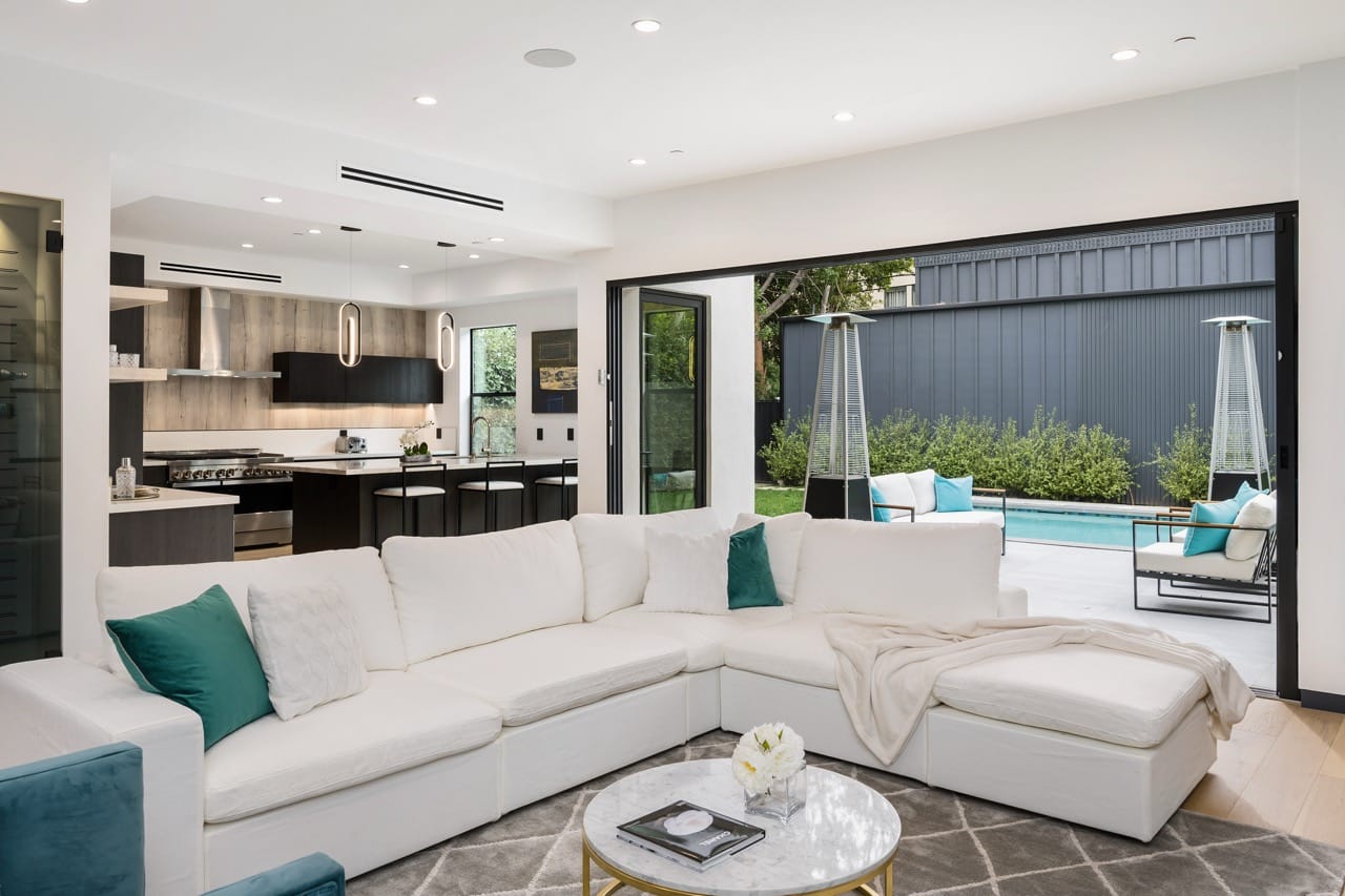 Bright modern living space with pool view