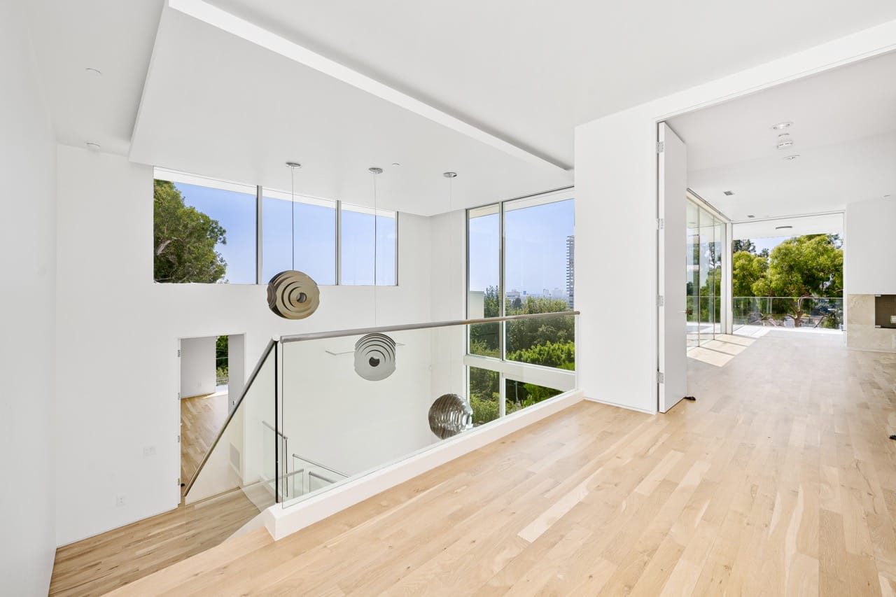 Modern interior with wood floors and large windows