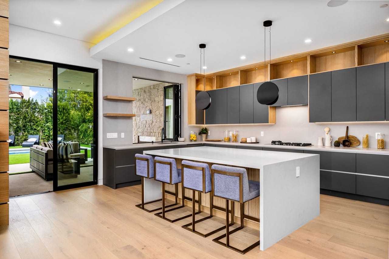 Modern kitchen interior with island and outdoor view
