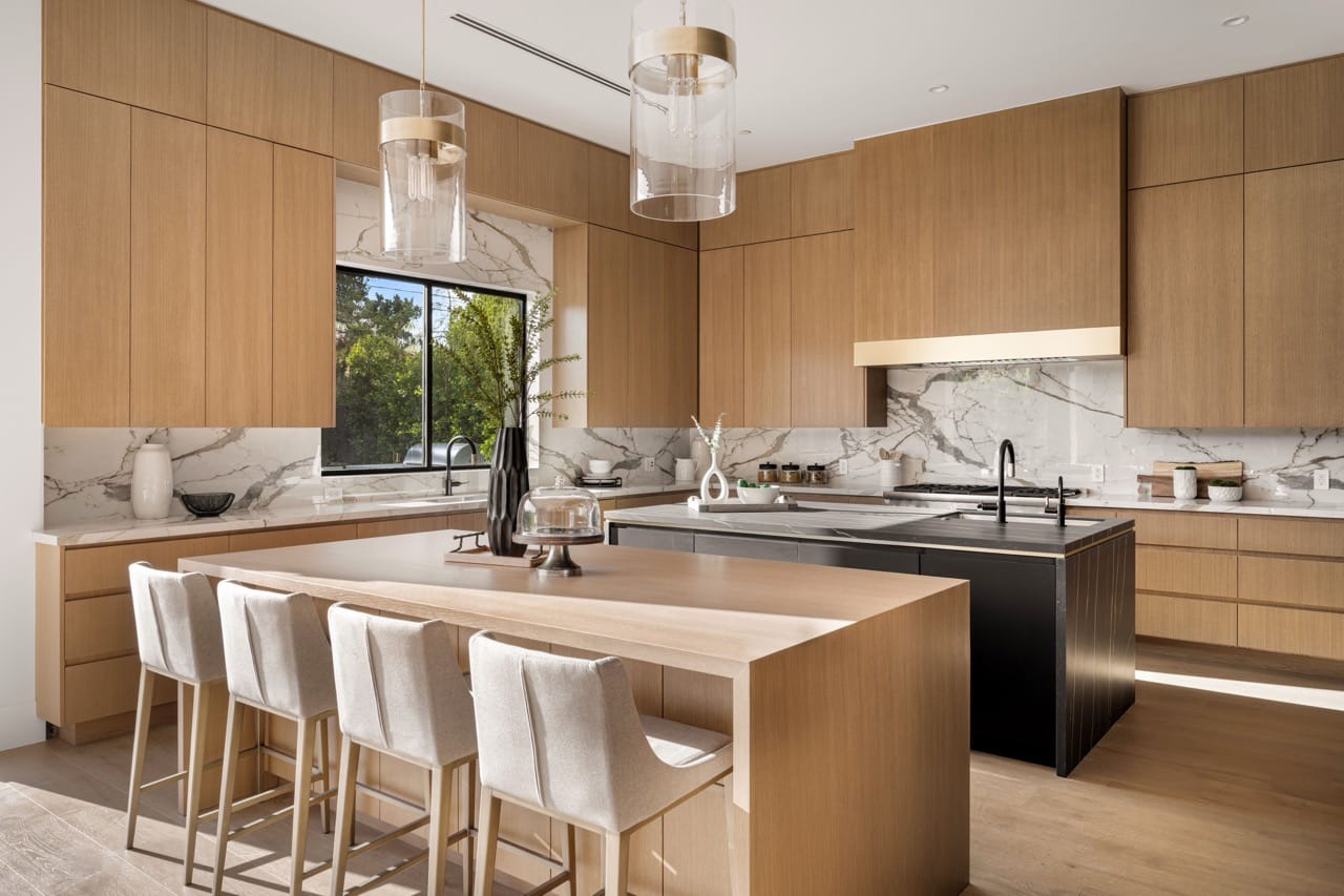 Modern kitchen interior with island and stylish lighting