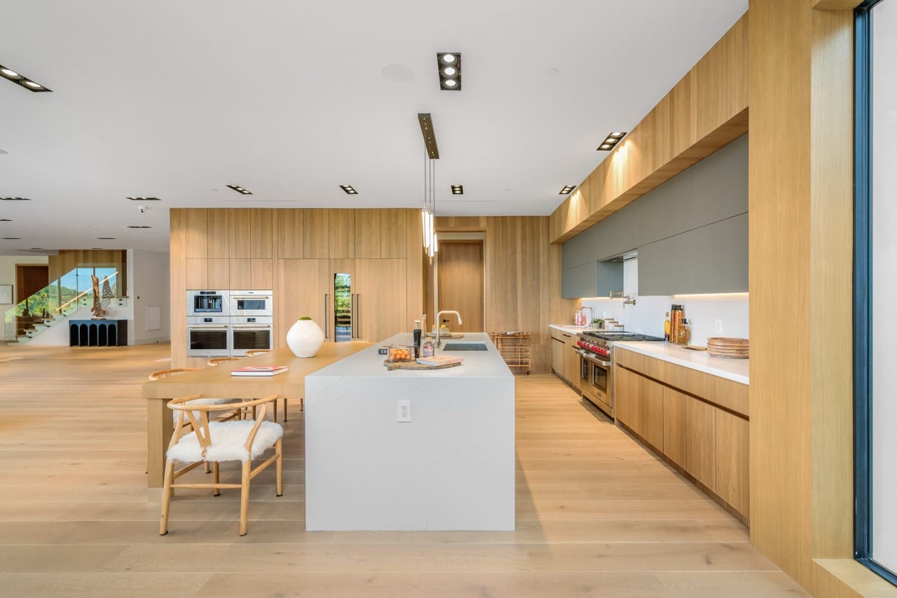 Modern kitchen interior with wood and white island