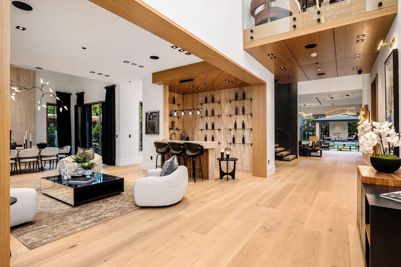 Modern open concept living area with wooden floors